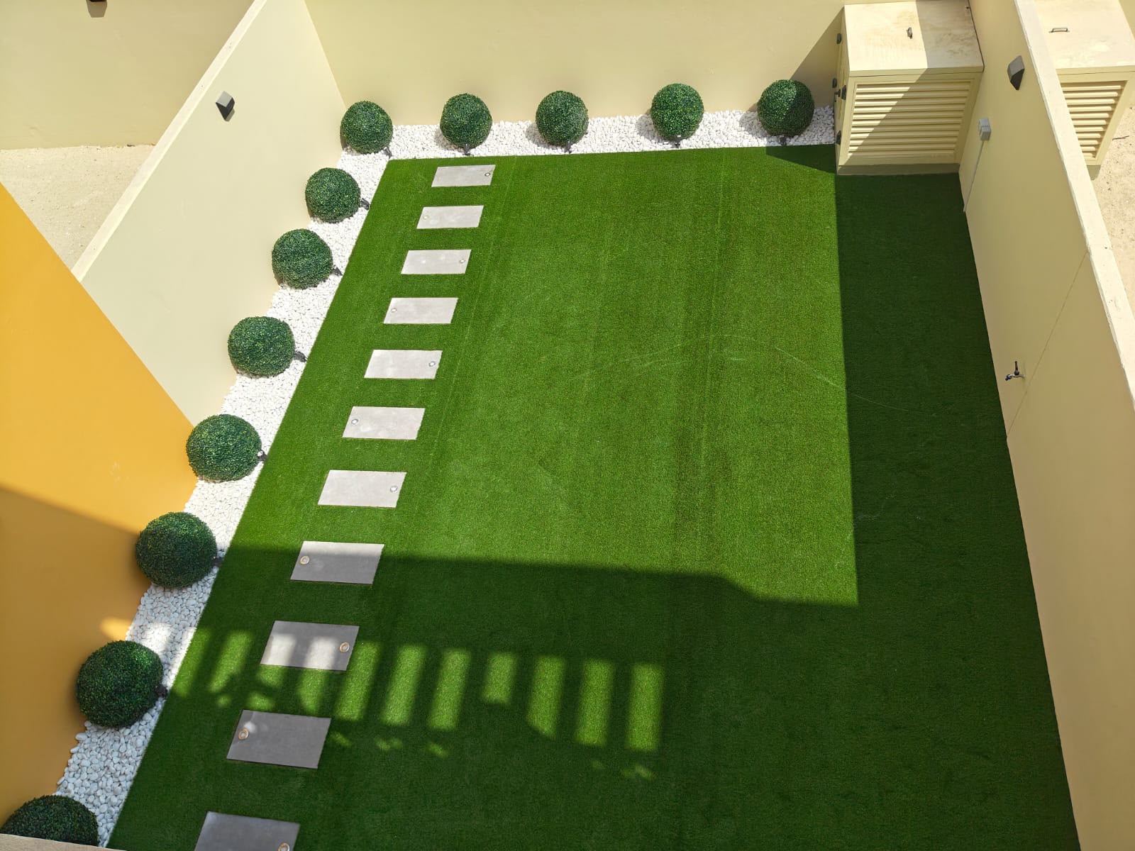 Landscaping Services DAMAC Hills 2 Dubai 2 DAMAC Hills 2 villa garden artificial grass installation view from living room